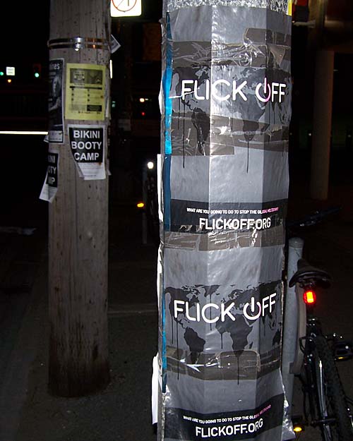 posters on traffic lights in Toronto along Queens Quay