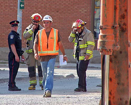 The police and fire respond to a gas main broken during road construction by the contractor - King