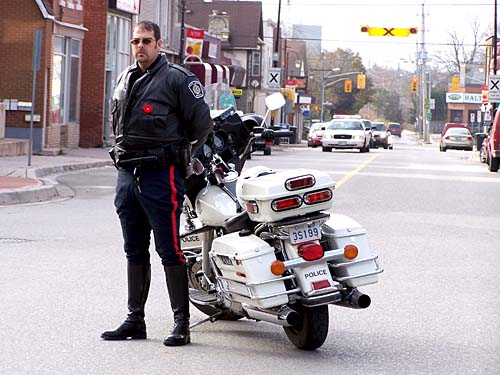 Remembrance Day ceremony 2007. Police block off Acton, Ontario downtown Mill Street East for the parade and ceremony.