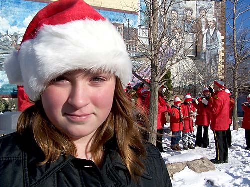 Erin in Santa hat in front of Acton Citizen's Band