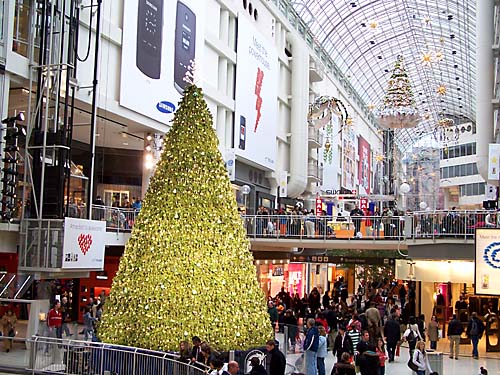 Boxing week sales at the Toronto Eaton Centre. Christmas trees and decorations still remain in the huge mall