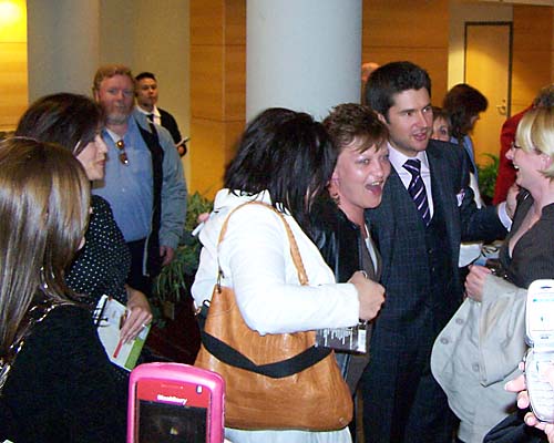 Autograph seekers gather around singer Matt Dusk after a great concert.