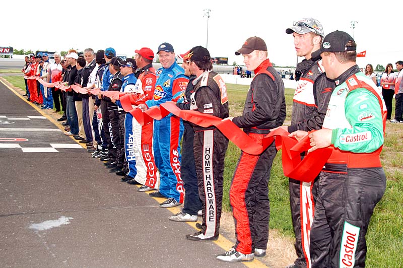 Nascar Canadian Tire Series 2007 - first race at Cayuga Speedway, Ontario. Drivers and VIPS cutting ribbon.