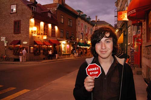 Kevin with an arret stop sign in old Quebec City