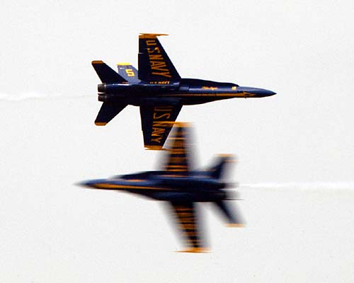 A pair of US Navy Blue Angels pass side by side at the Quebec International Air Show 2008