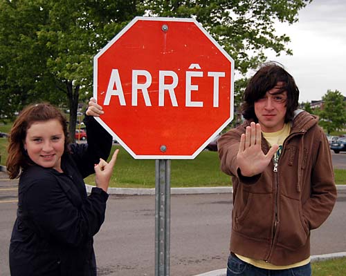 Erin and Kevin at a Quebec stop sign - arret