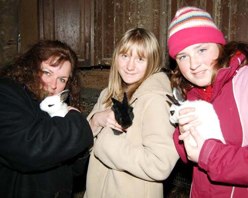 Ann, Brianna and Erin cuddle some cute baby bunnies