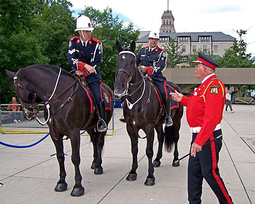 Honour guards, including some of the Toronto Police Mounted Unit, gather for the DDay anniversary event at Nathan Phillips Square, City Hall, Toronto.