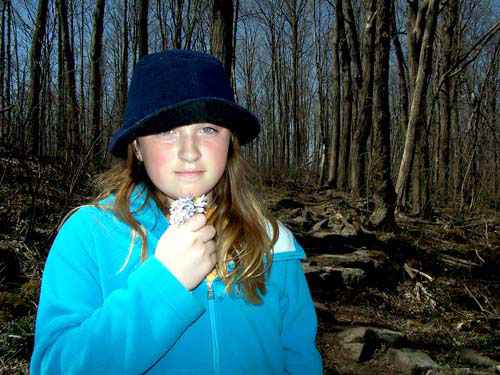 Erin holds some spring flowers picked along the Bruce Trail (Niagara Escarpment) in Milton.