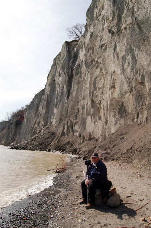 Joe sits at the edge of the Scarbourgh Bluffs at Bluffers Park, Ontario